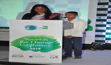 A beneficiary child with the host of the event